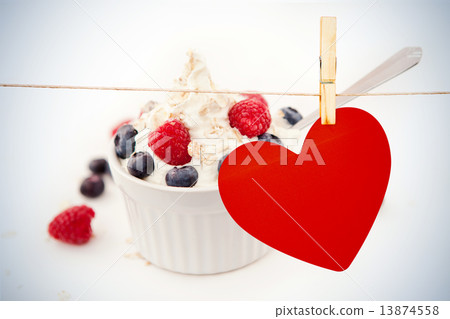 Composite image of heart hanging on line 13874558