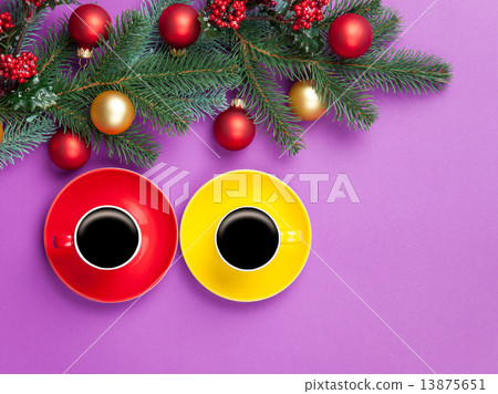 Hot coffee and pine branch with christmas toys on violet backgro Hot coffee and pine branch with christmas toys on violet backgro 13875651