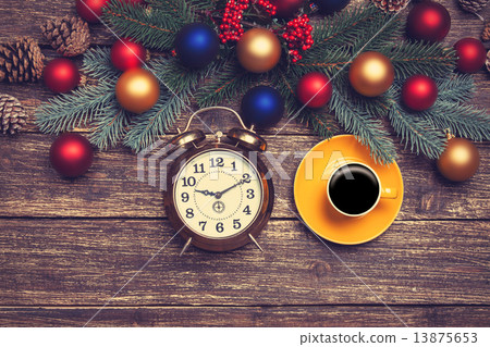 Hot coffee on a table near pine branches with chritmas balls Hot coffee on a table near pine branches with chritmas balls 13875653