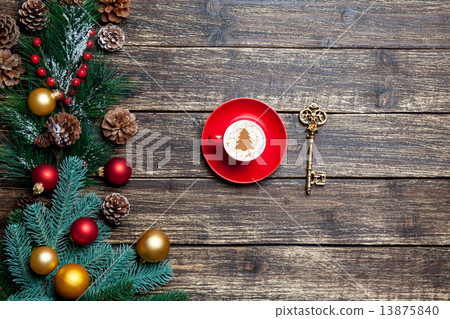 Cappuccino with christmas tree shape and pine branch on wooden t 13875840