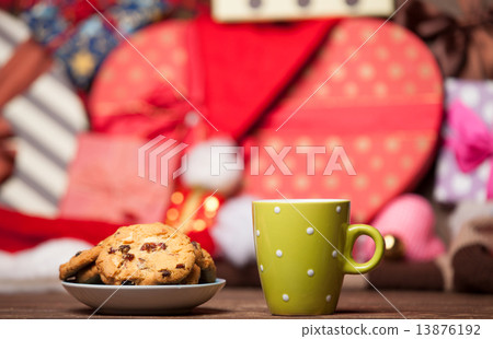 Cookie and cup of coffee on christmas background. Cookie and cup of coffee on christmas background. 13876192