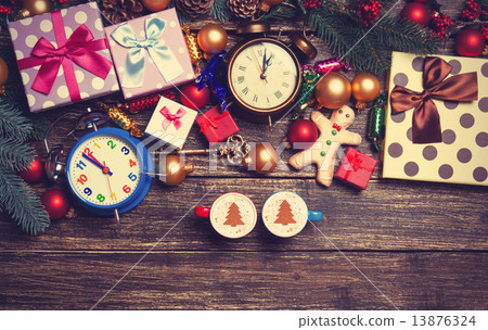 Gifts, two cups of coffee and pine branch on a wooden table. 13876324