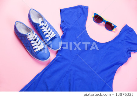 Gumshoes, sunglasses and dress on pink background. Gumshoes, sunglasses and dress on pink background. 13876325