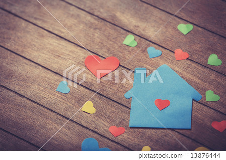 Paper house on wooden table. Paper house on wooden table. 13876444