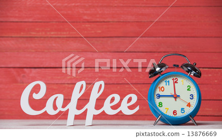 Alarm clock and wooden word Coffee. Alarm clock and wooden word Coffee. 13876669
