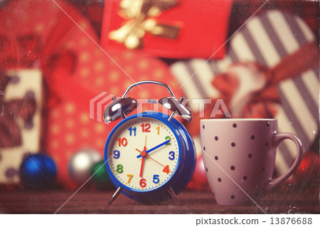 Vintage clock and cup of coffee on christmas background Vintage clock and cup of coffee on christmas background 13876688
