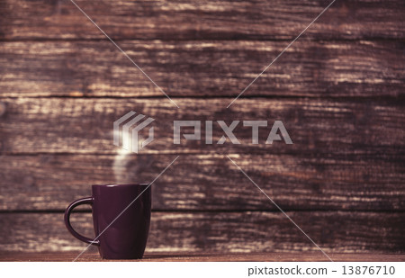 Tea or coffee cup on wooden table. Tea or coffee cup on wooden table. 13876710
