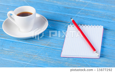 Cup of coffee and notebook. Cup of coffee and notebook. 13877292