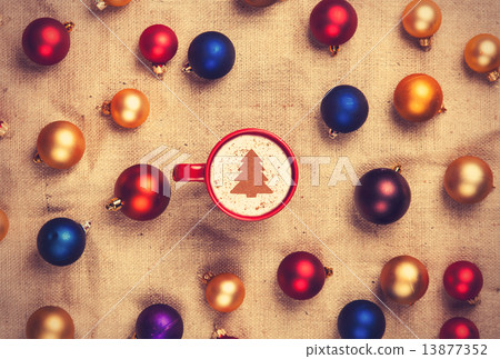 cappuccino and with red, blue and gold christmas balls cappuccino and with red, blue and gold christmas balls 13877352