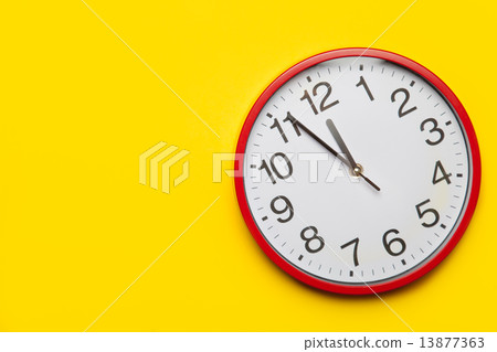Huge red clock on yellow background. Huge red clock on yellow background. 13877363