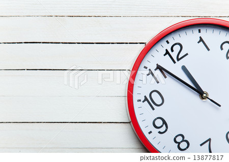 Huge clock on a table. 13877817