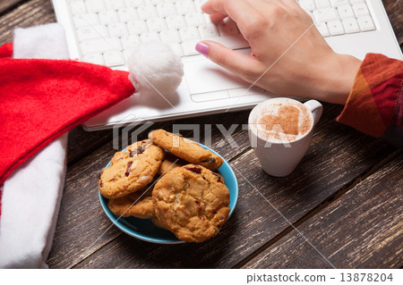 Cookie and women hand with notebook. Cookie and women hand with notebook. 13878204