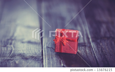 Christmas gift box on wooden table Christmas gift box on wooden table 13878215