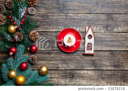 Cappuccino with christmas tree shape and toy house on wooden tab Cappuccino with christmas tree shape and toy house on wooden tab 13878218