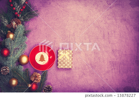 Cappuccino with christmas tree shape and gift box on violet back 13878227