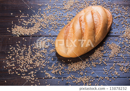 Delicious bread on a wood table Delicious bread on a wood table 13878232