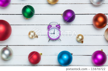 Alarm clock and christmas balls on white table. Alarm clock and christmas balls on white table. 13878722
