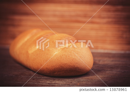 Delicious bread on a wood table 13878961