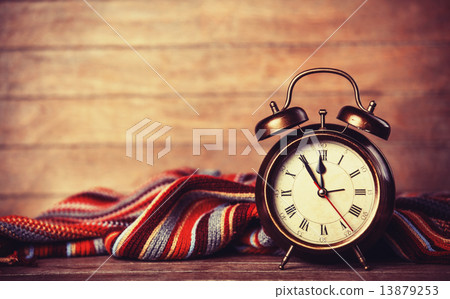 Alarm clock and scarf. Alarm clock and scarf. 13879253