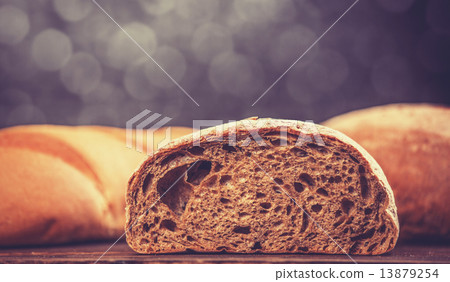 Delicious bread on a wood table 13879254