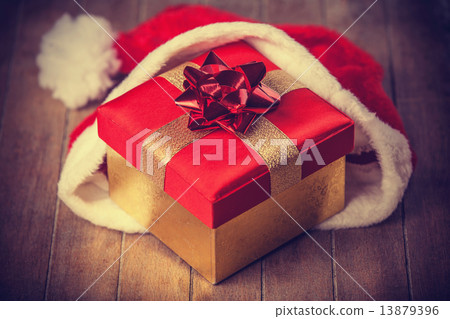 gift in christmas hat gift in christmas hat 13879396