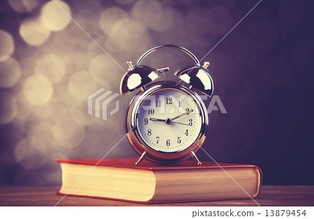 Alarm clock and book Alarm clock and book 13879454