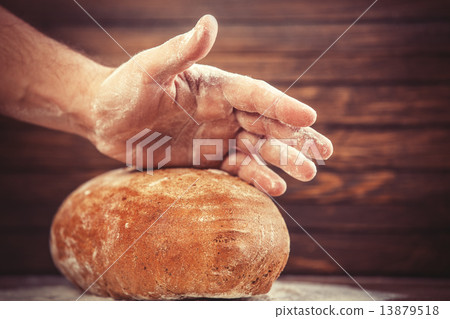 Baker's hands with a bread. Baker's hands with a bread. 13879518