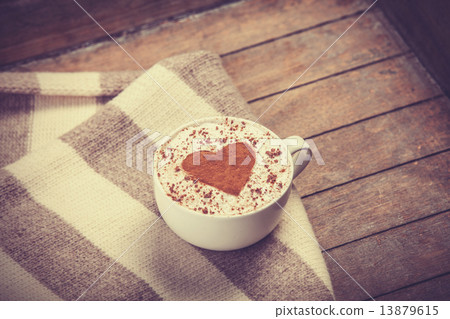 Cup with coffee and scarf. Cup with coffee and scarf. 13879615