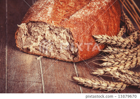 Delicious bread on a wood table Delicious bread on a wood table 13879670