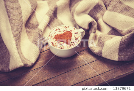 Cup with coffee and scarf. Cup with coffee and scarf. 13879671