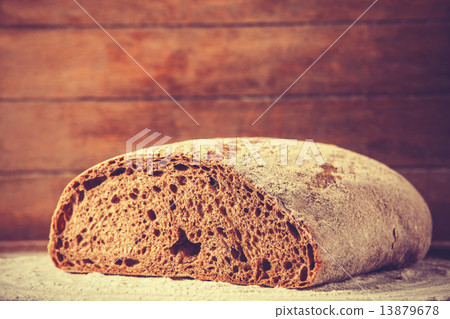 Delicious bread on a wood table 13879678