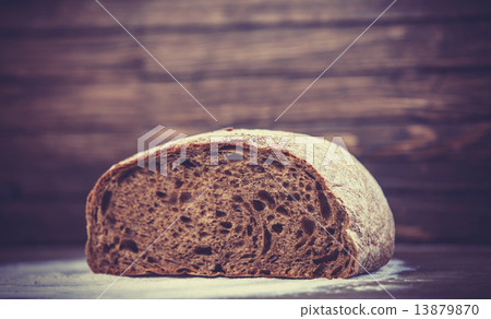Delicious bread on a wood table 13879870