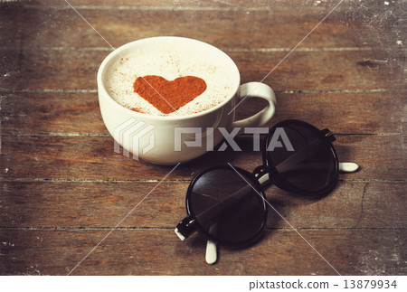 Cup of coffee with sunglasses 13879934
