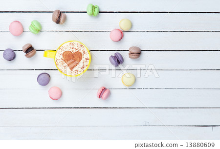 Cappuccino with heart shape symbol and macaron Cappuccino with heart shape symbol and macaron 13880609