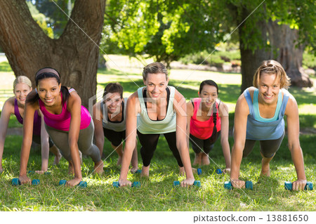 Fitness group planking in park 13881650