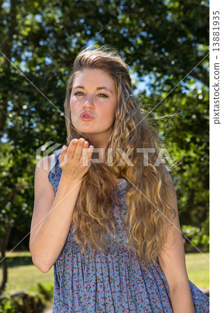 Pretty blonde blowing a kiss 13881935