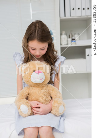 Little girl with her teddy bear in her harms Little girl with her teddy bear in her harms 13882359