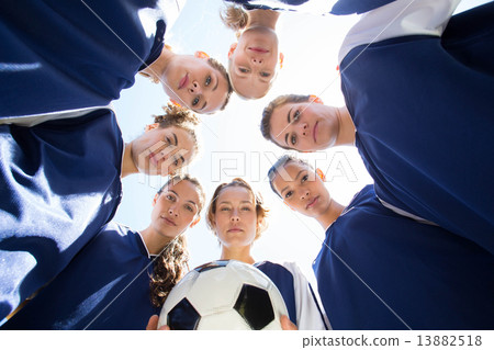 Pretty football players smiling at camera 13882518