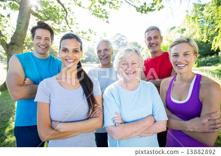 Happy athletic group with arms crossed Happy athletic group with arms crossed 13882892