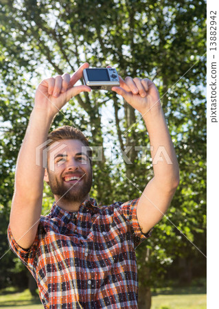Handsome hipster taking a selfie Handsome hipster taking a selfie 13882942