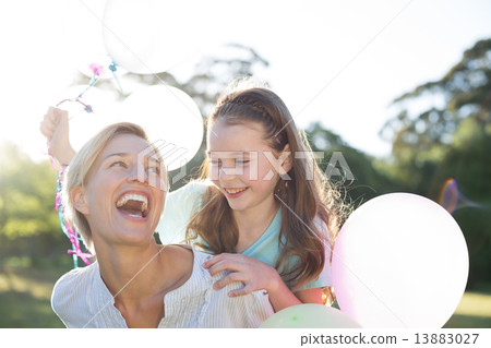 Happy mother playing with her daughter 13883027