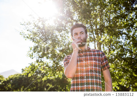 Hipster smoking an electronic cigarette Hipster smoking an electronic cigarette 13883112