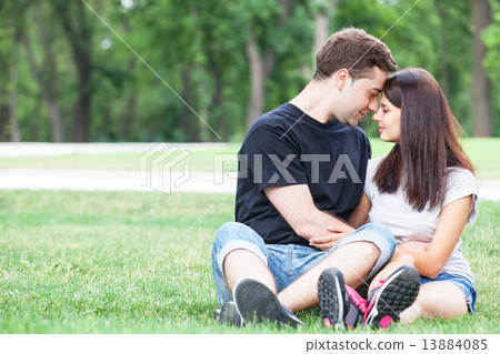 Young teen couple kissing at outdoor Young teen couple kissing at outdoor 13884085