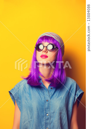 Beautiful girl with violet hair in sunglasses on yellow backgrou Beautiful girl with violet hair in sunglasses on yellow backgrou 13884086