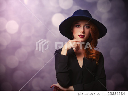 Style redhead women in black on classic background 13884284