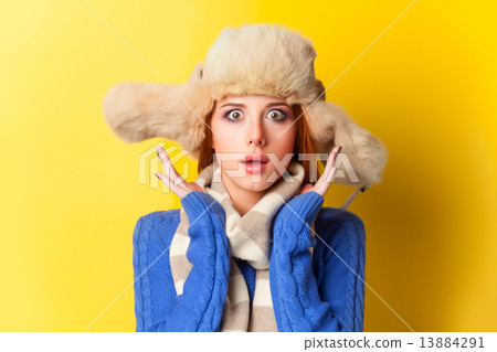 Redhead girl in hat on yellow background. Redhead girl in hat on yellow background. 13884291