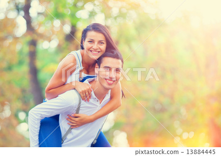 Couple hugging in the park. 13884445