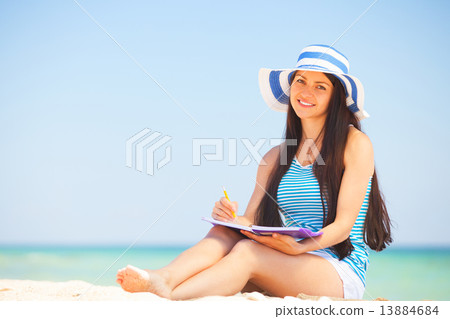Young brunette girl with note and pencil Young brunette girl with note and pencil 13884684