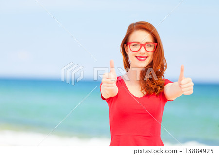 Redhead girl in the glasses on the beach Redhead girl in the glasses on the beach 13884925