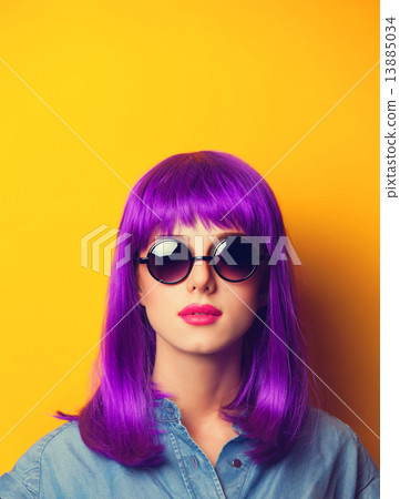 Beautiful girl with violet hair in sunglasses on yellow backgrou Beautiful girl with violet hair in sunglasses on yellow backgrou 13885034